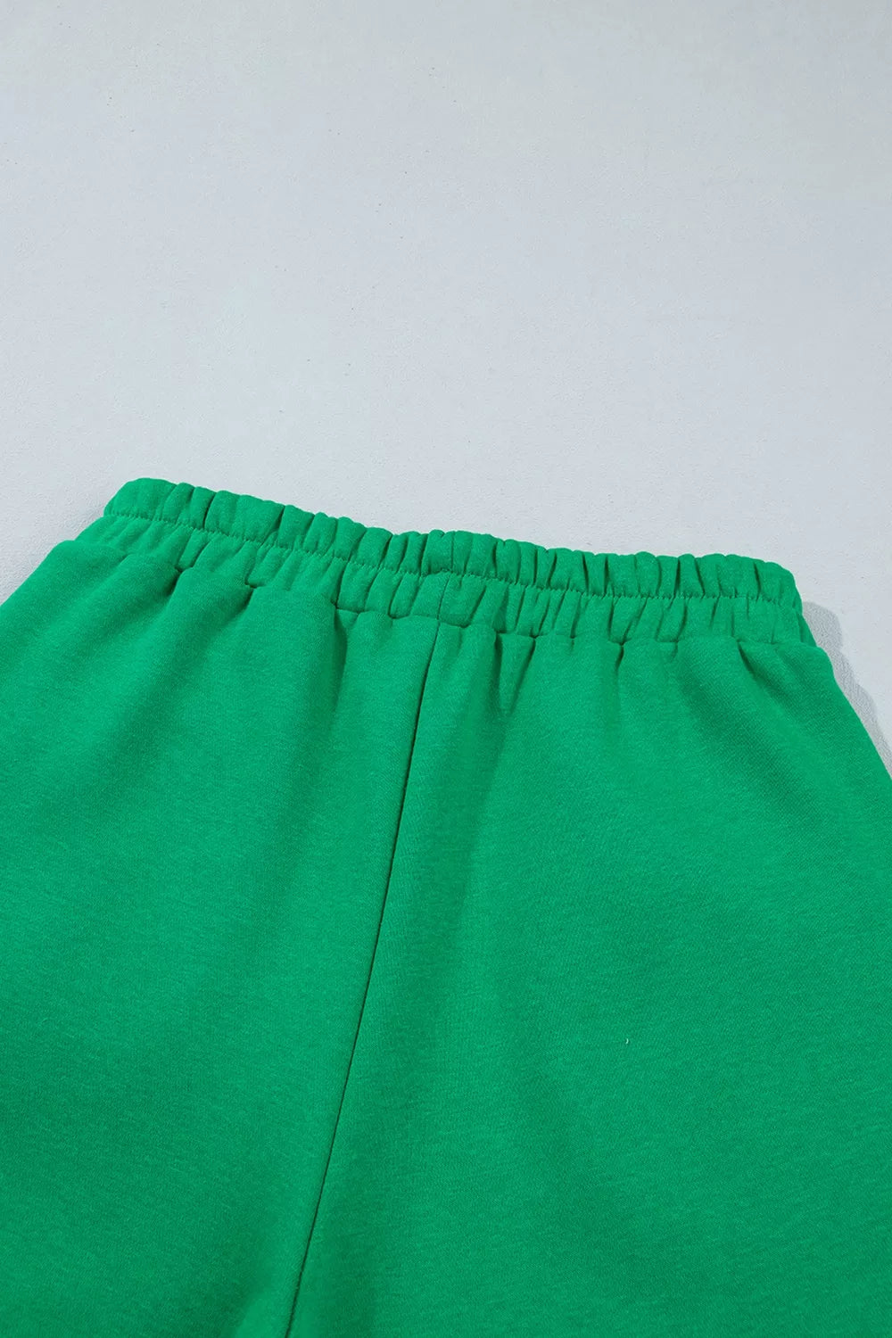 Green sweatshirt and shorts set with polka-dot trim, shorts elastic waist detail