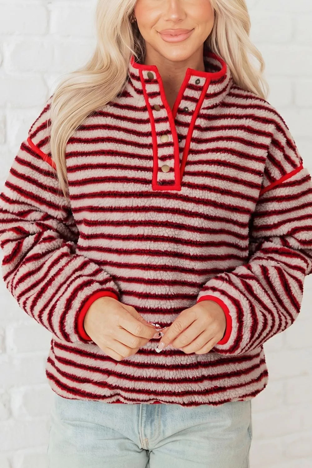 Red and cream striped fuzzy snap-placket sweatshirt, front detail