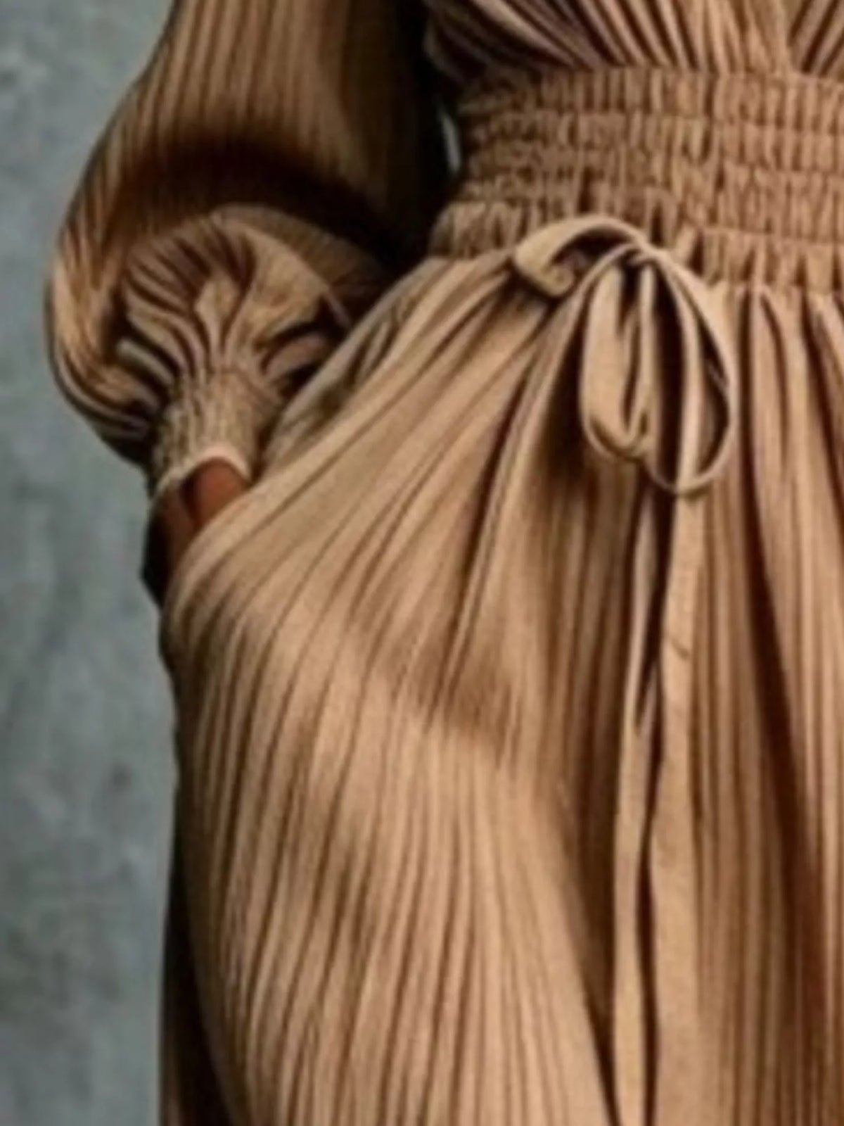Camel pleated v-neck tie-waist maxi dress, waist and pocket detail.
