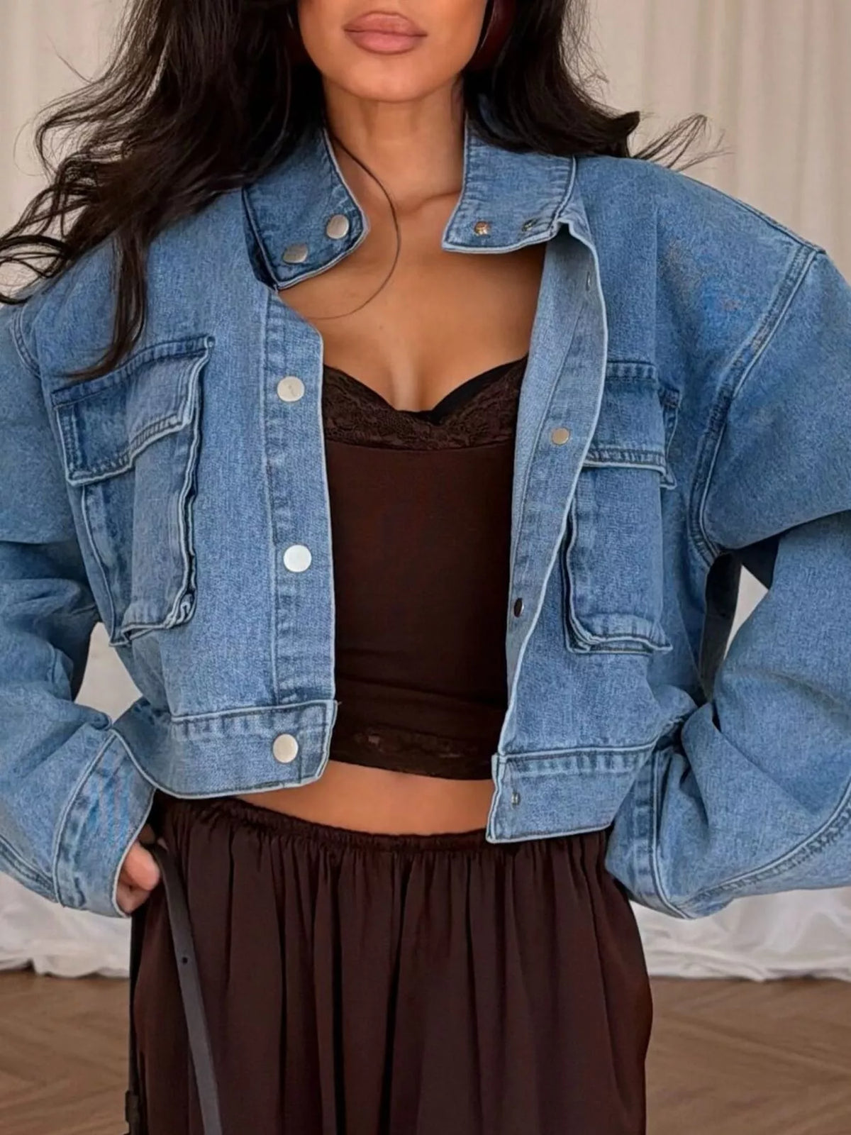 Blue oversized cropped denim utility jacket, front view open.