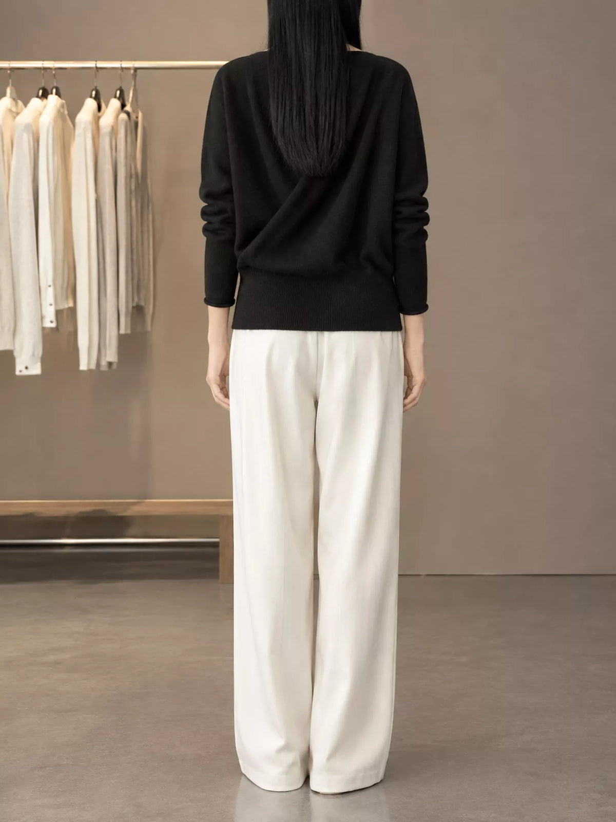 Black wrap-front sweater, back view