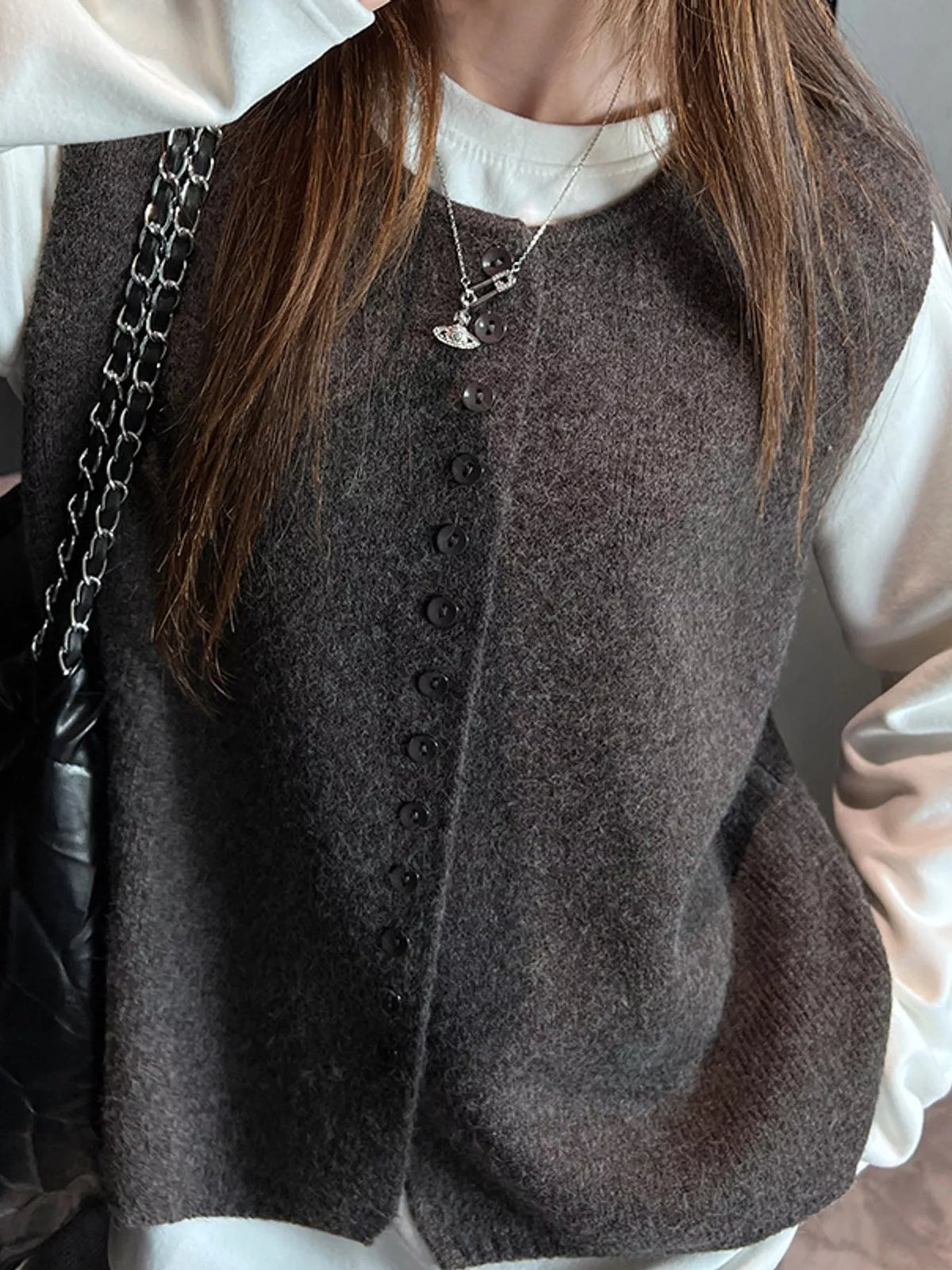 Dark gray sleeveless sweater vest