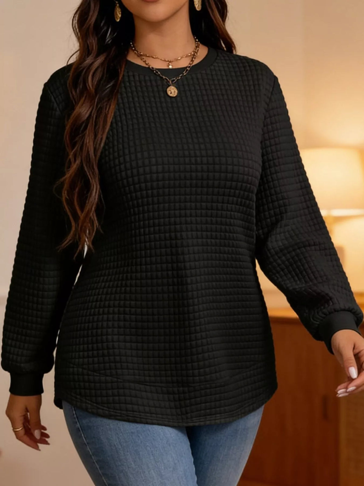 Black waffle knit sweatshirt with curved hem
