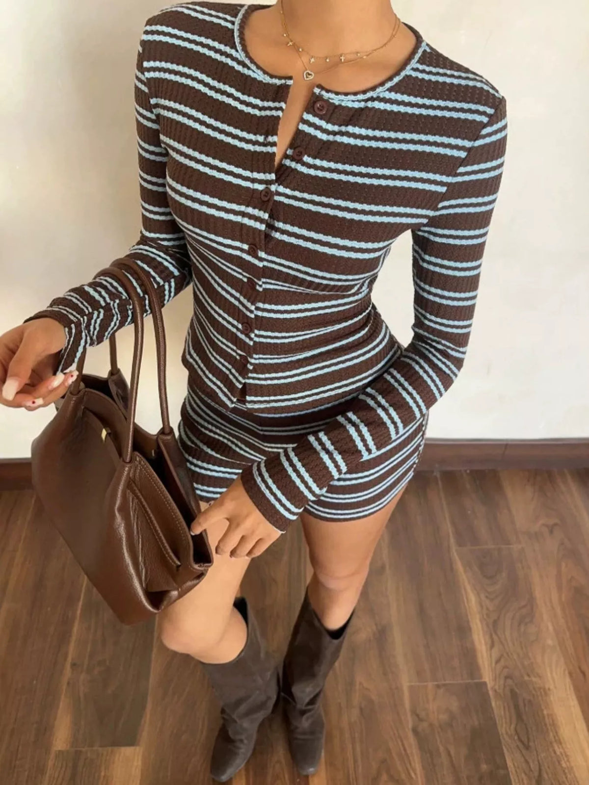 Striped cardigan and shorts set in brown and blue, angled front view