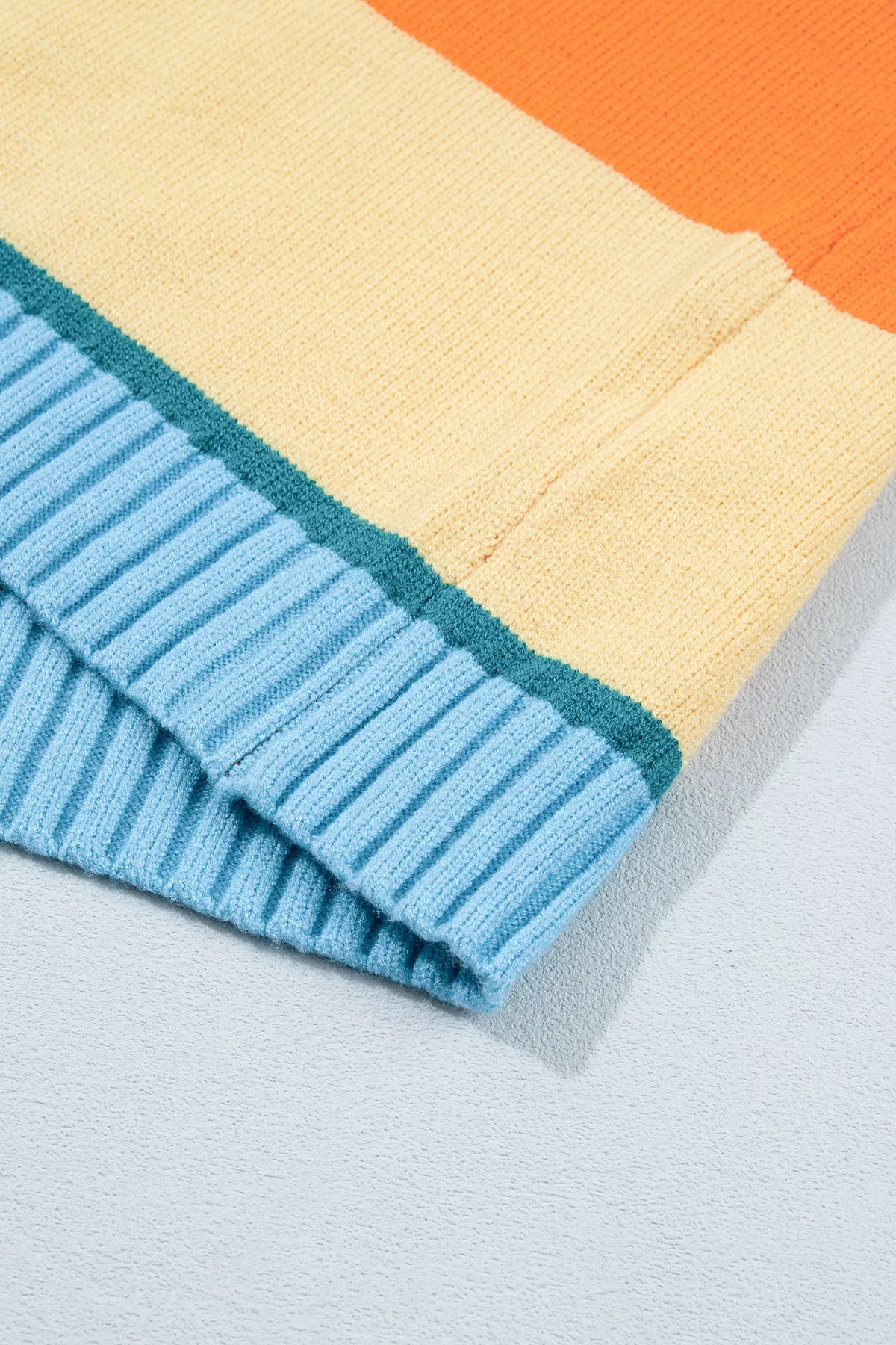 Striped colorblock sweater, blue hem detail