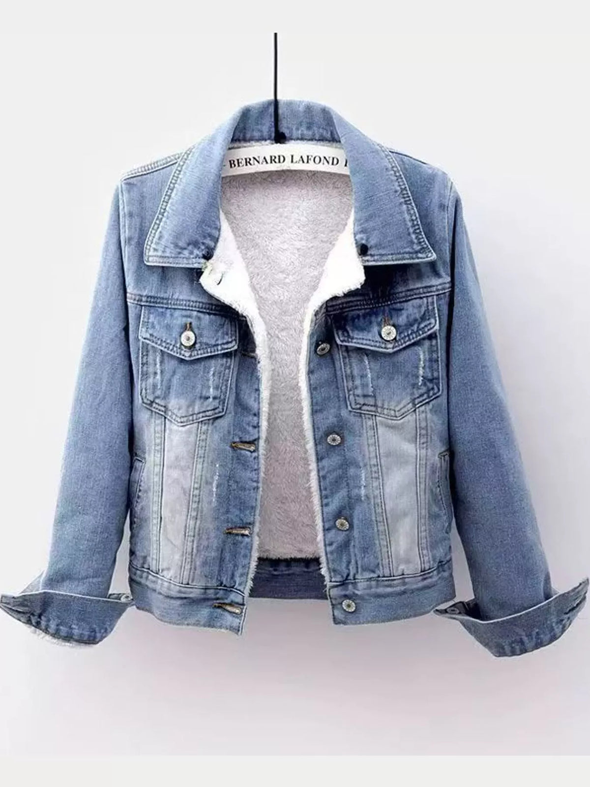 Light blue distressed denim jacket with sherpa fleece lining