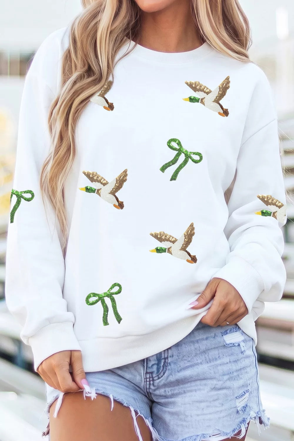 White mallard and bow sequin sweatshirt, front view