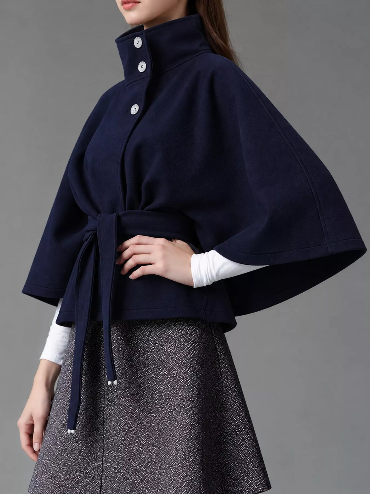 Navy belted button-front cape — side view