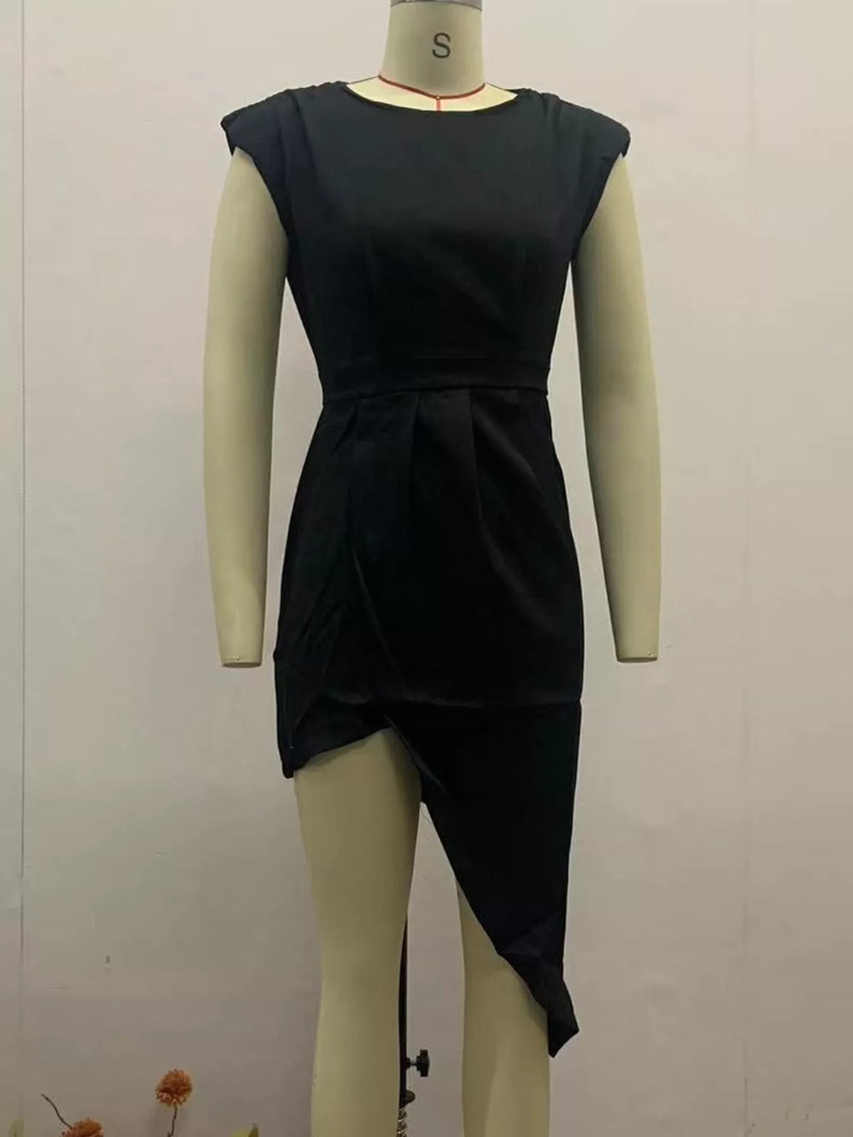 Women's Asymmetrical Backless Pleated Dress in black — mannequin front view