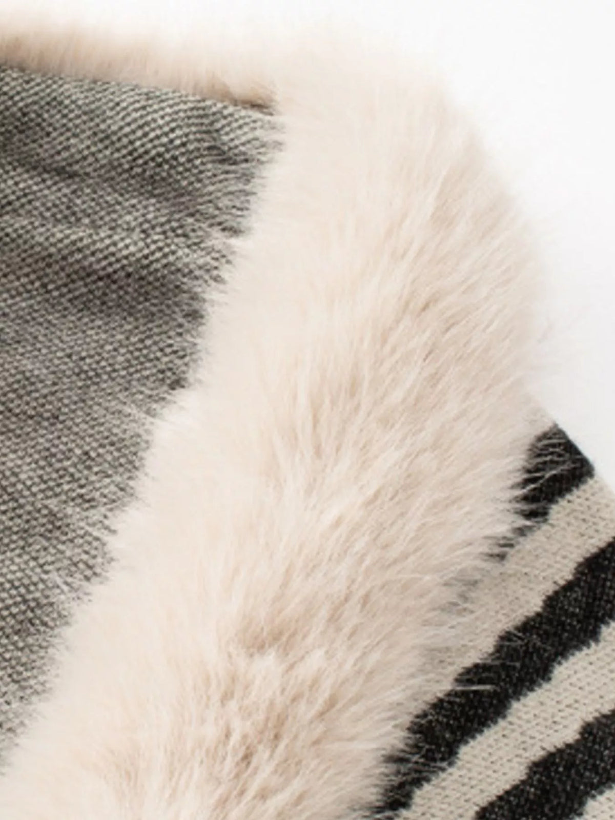 Faux Fur Trimmed Striped Knit Fringe Poncho, detail view in cream and black