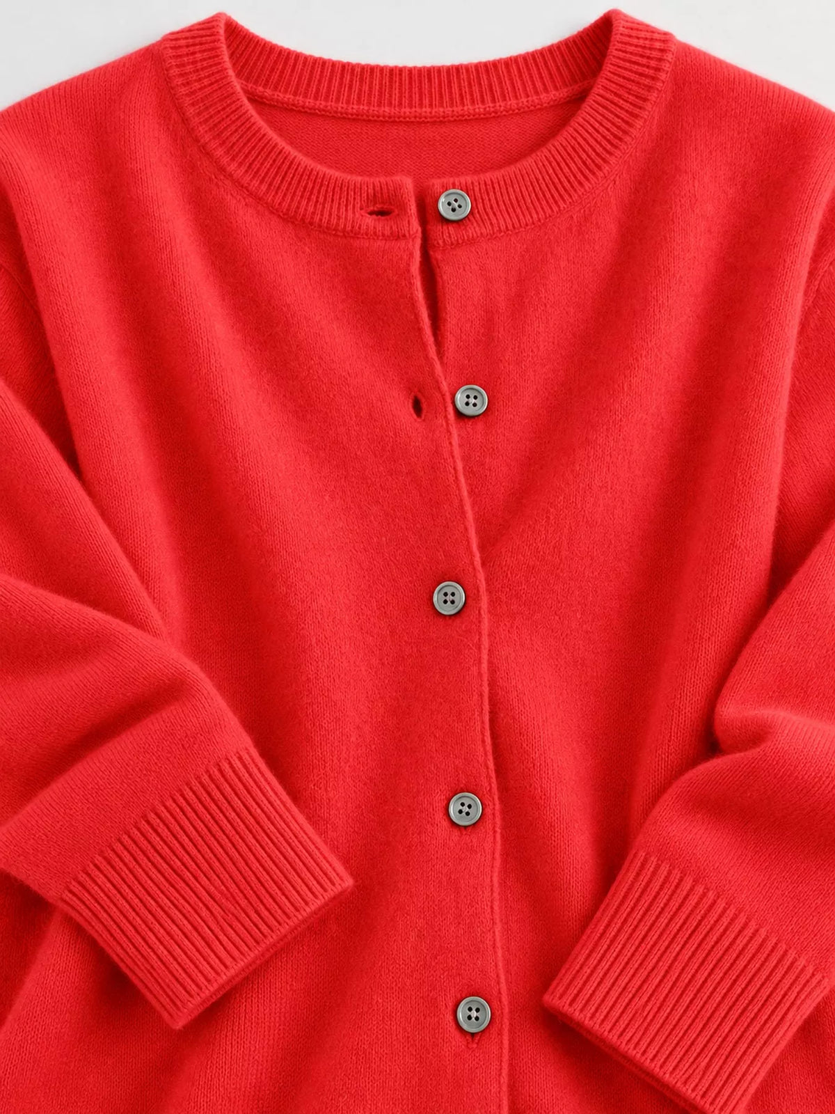 Button-down cardigan, red button cuff detail