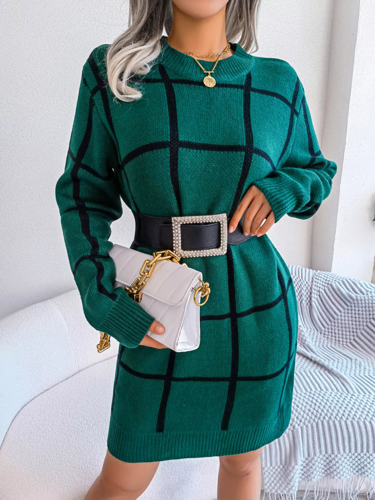 Green windowpane long-sleeve sweater dress, belted front with handbag.