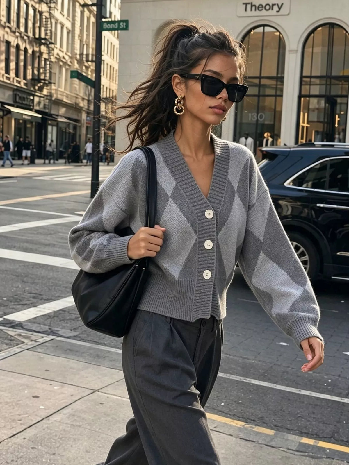 Gray argyle v-neck button-front cardigan, walking front view.