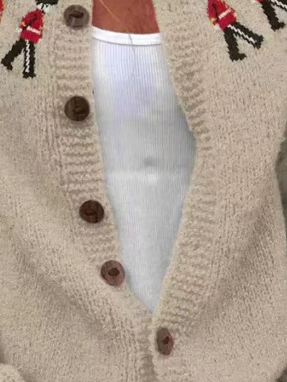 Tan British guard pattern cardigan, button-placket detail