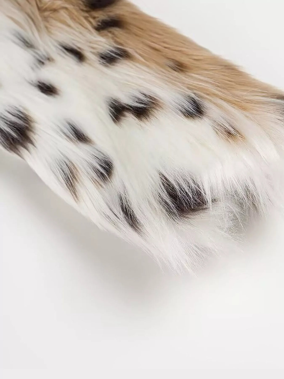 White and black leopard-print leopard faux fur turtleneck jacket, detail view