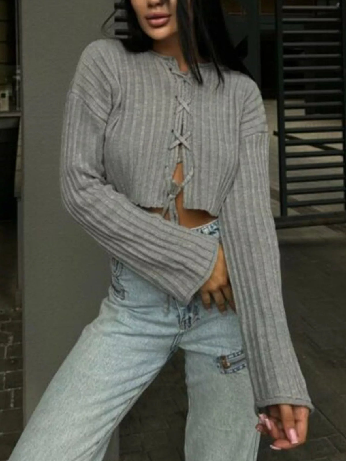 Gray ribbed lace-up cropped sweater, standing front view.