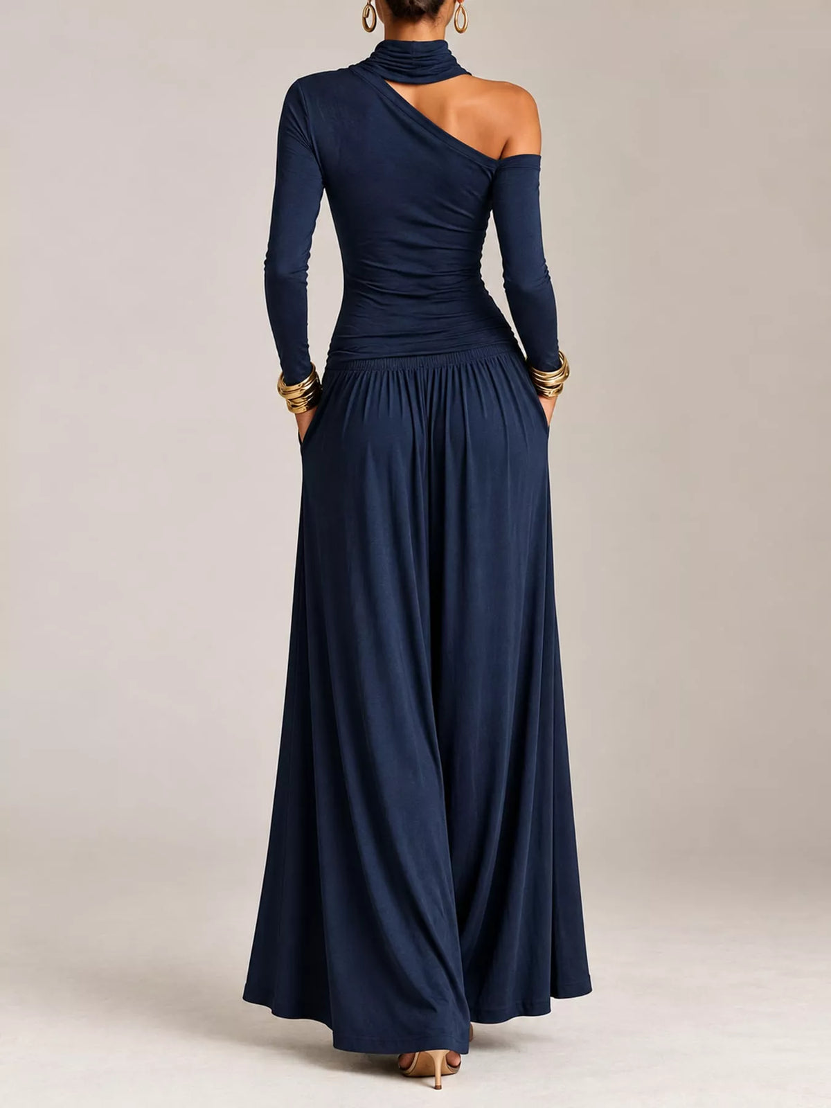Navy asymmetric shoulder-cutout maxi dress with gathered skirt, back view