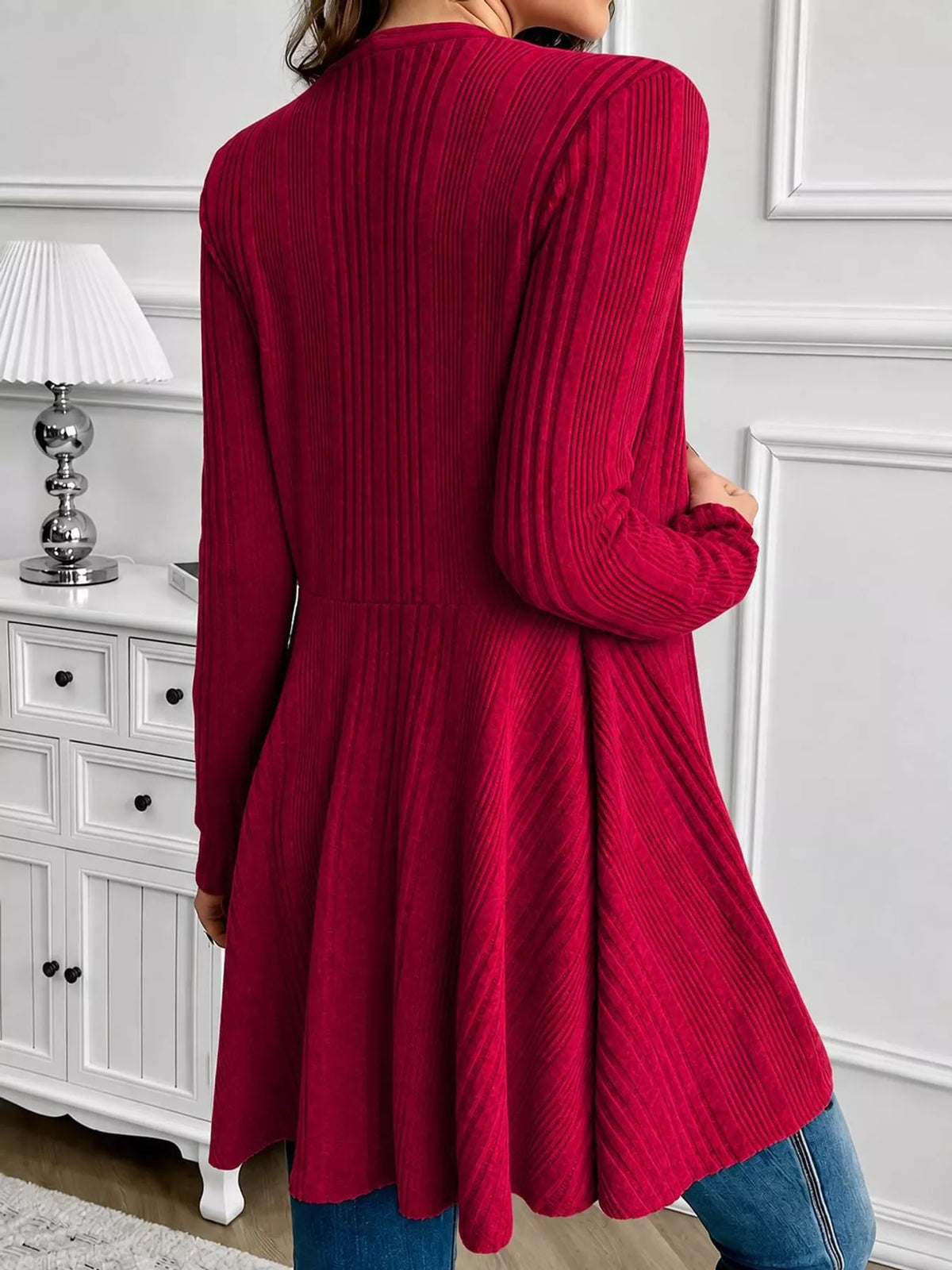Red ribbed knit open front cardigan, back view
