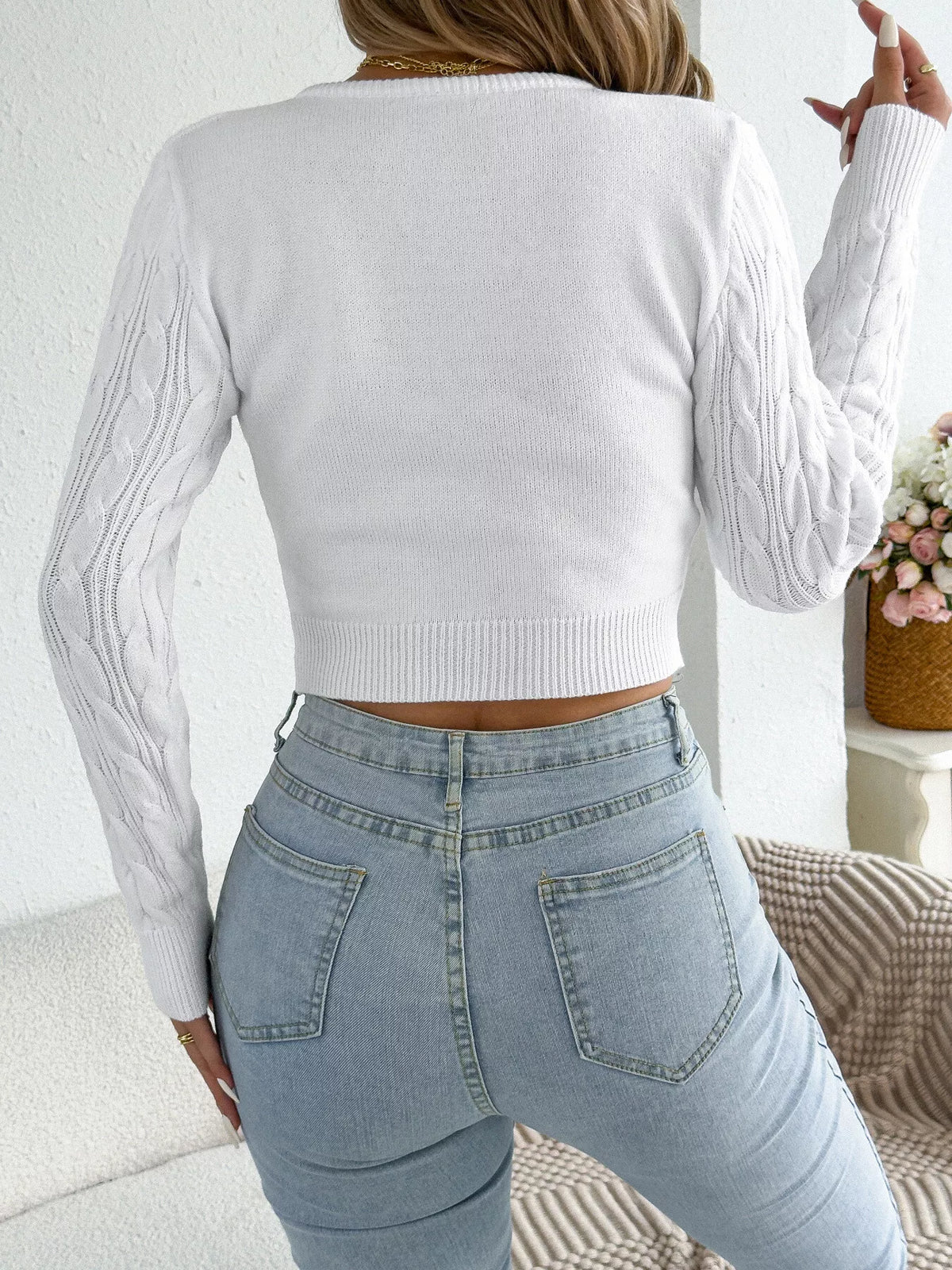 White half-zip cable knit sweater, back view