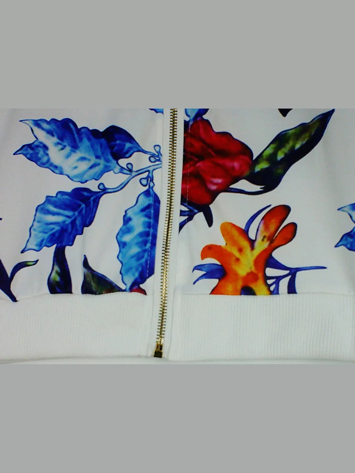 White tropical floral printed zip-up bomber jacket — design and construction details
