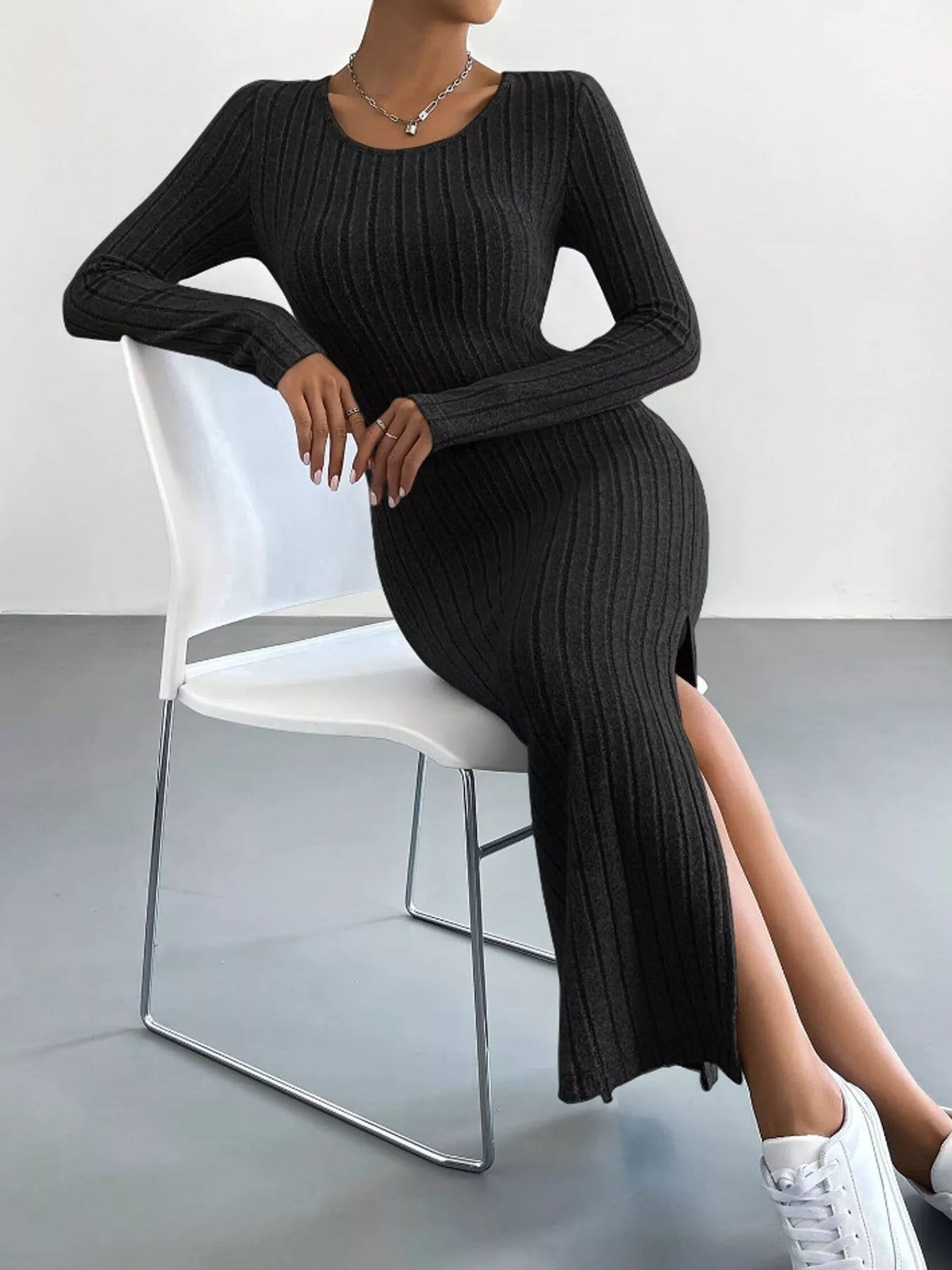 Black ribbed long sleeve knit dress with side slit