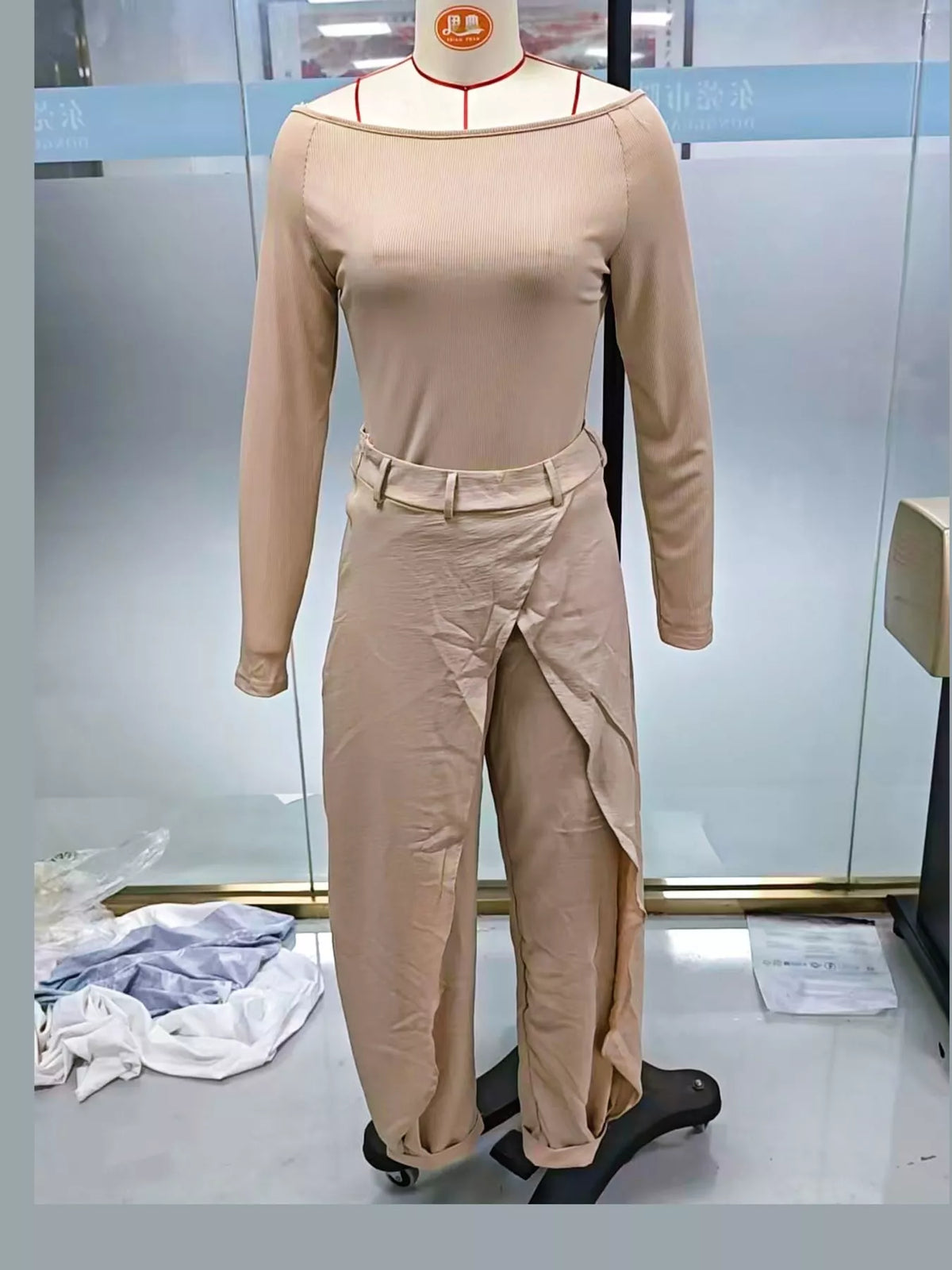 Beige boat neck long sleeve top and wrap pants set — front view