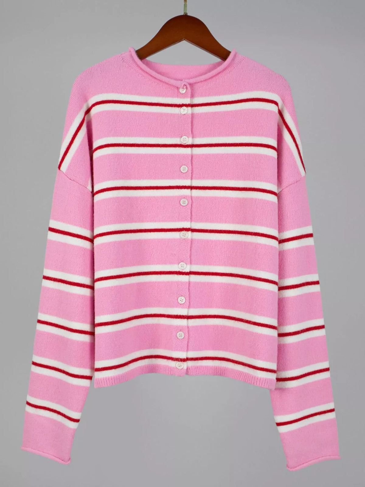 Pink striped button-front cardigan, front view on hanger