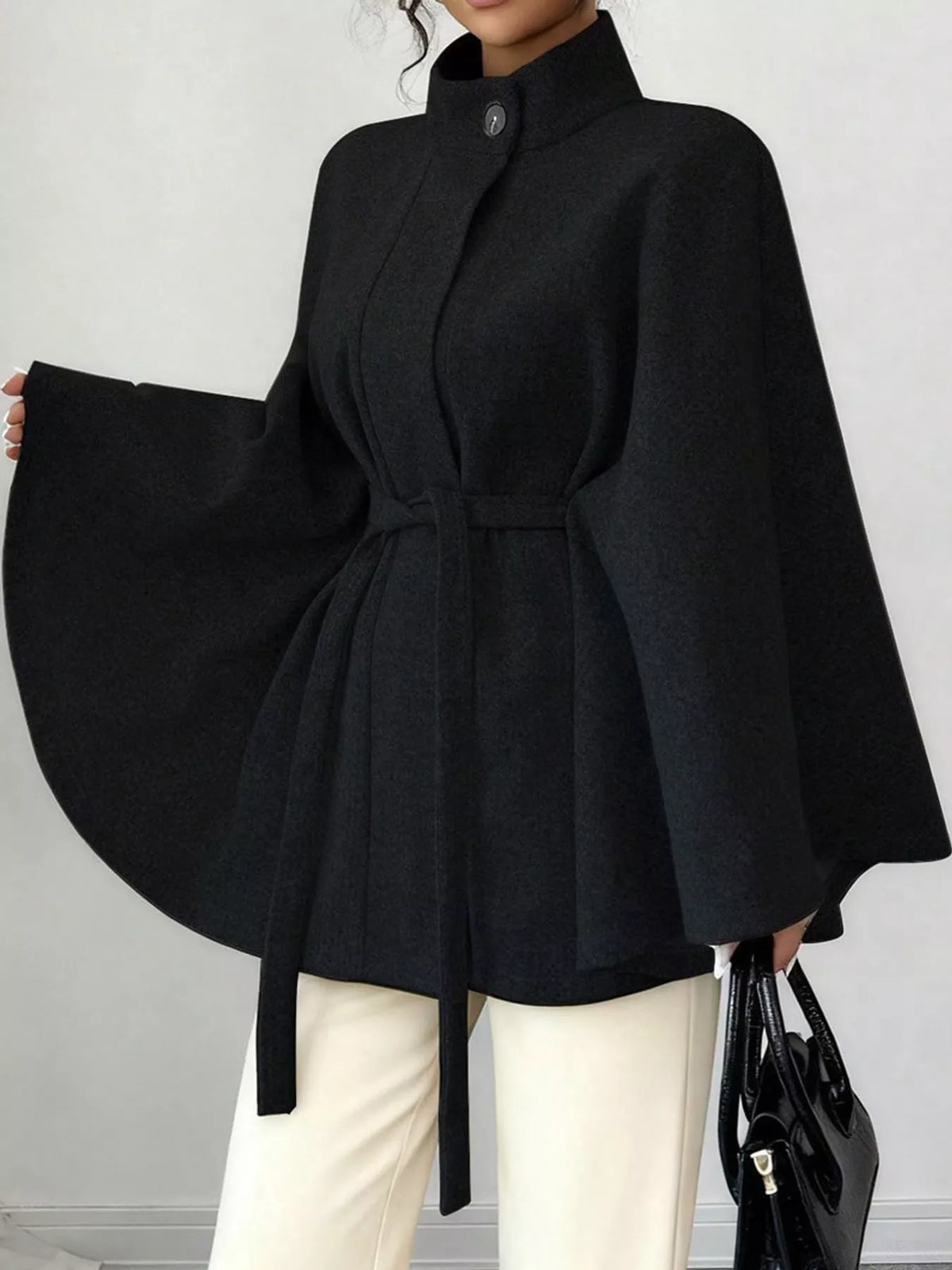 Black tie-waist cape — front view
