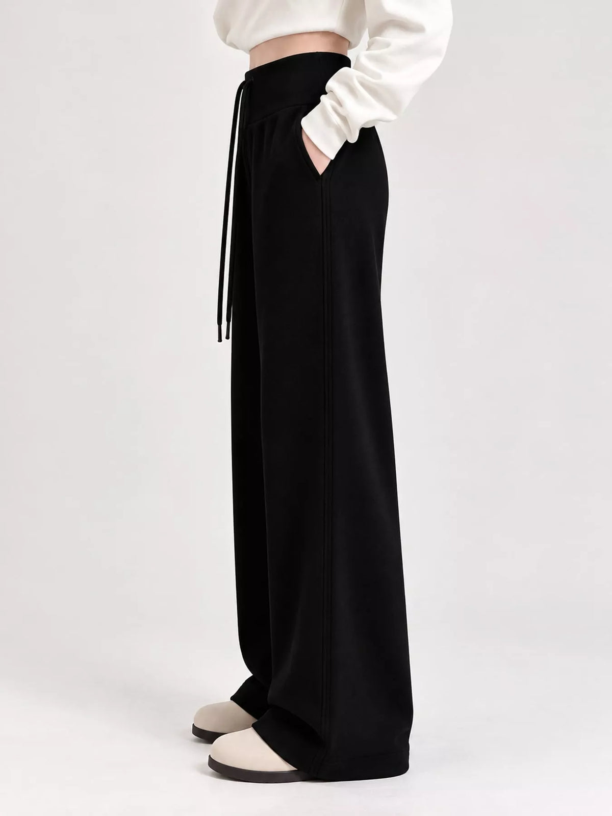 Black drawstring wide-leg pants — side view