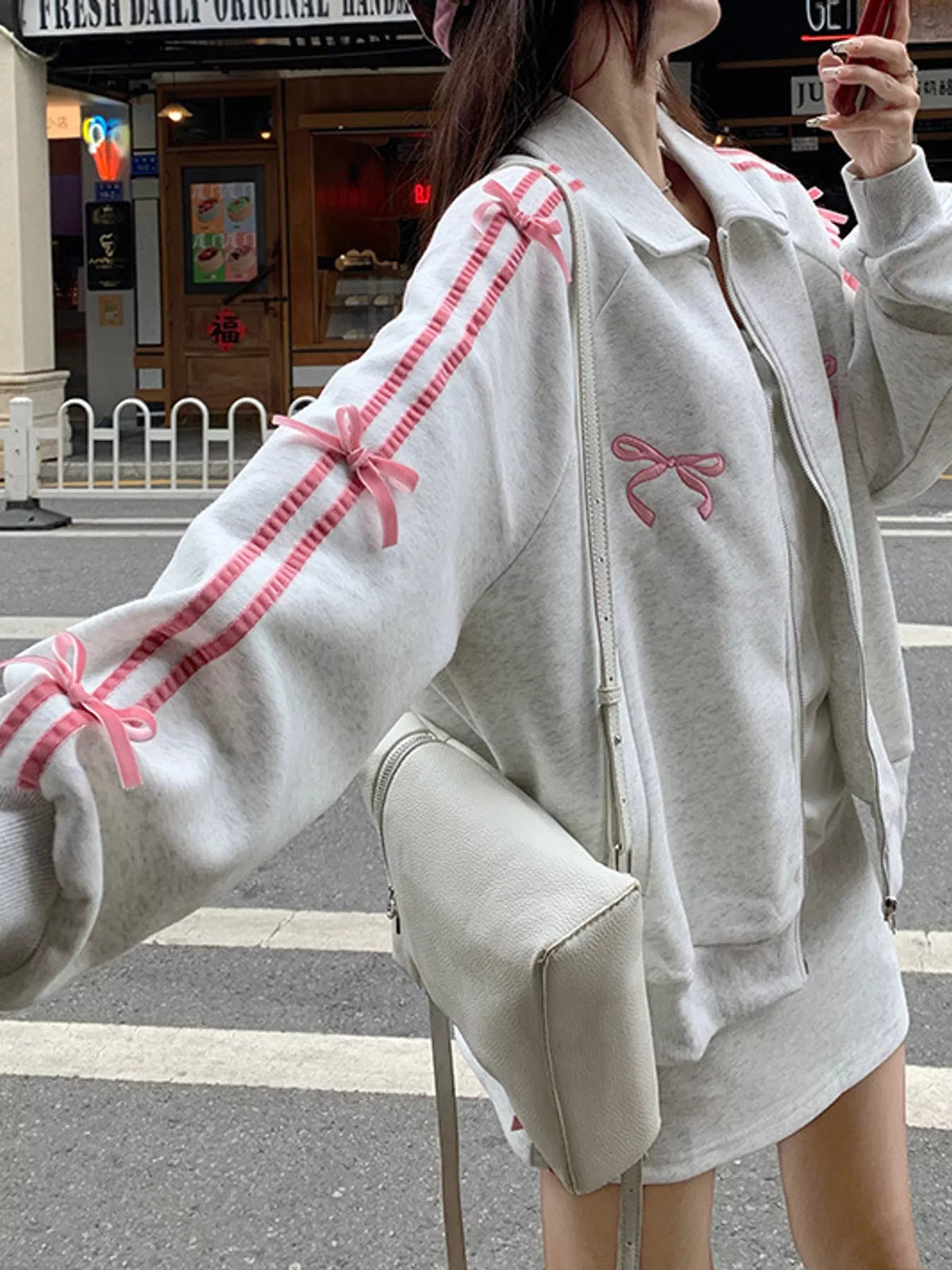 White and pink bow embroidered zip-up sweatshirt