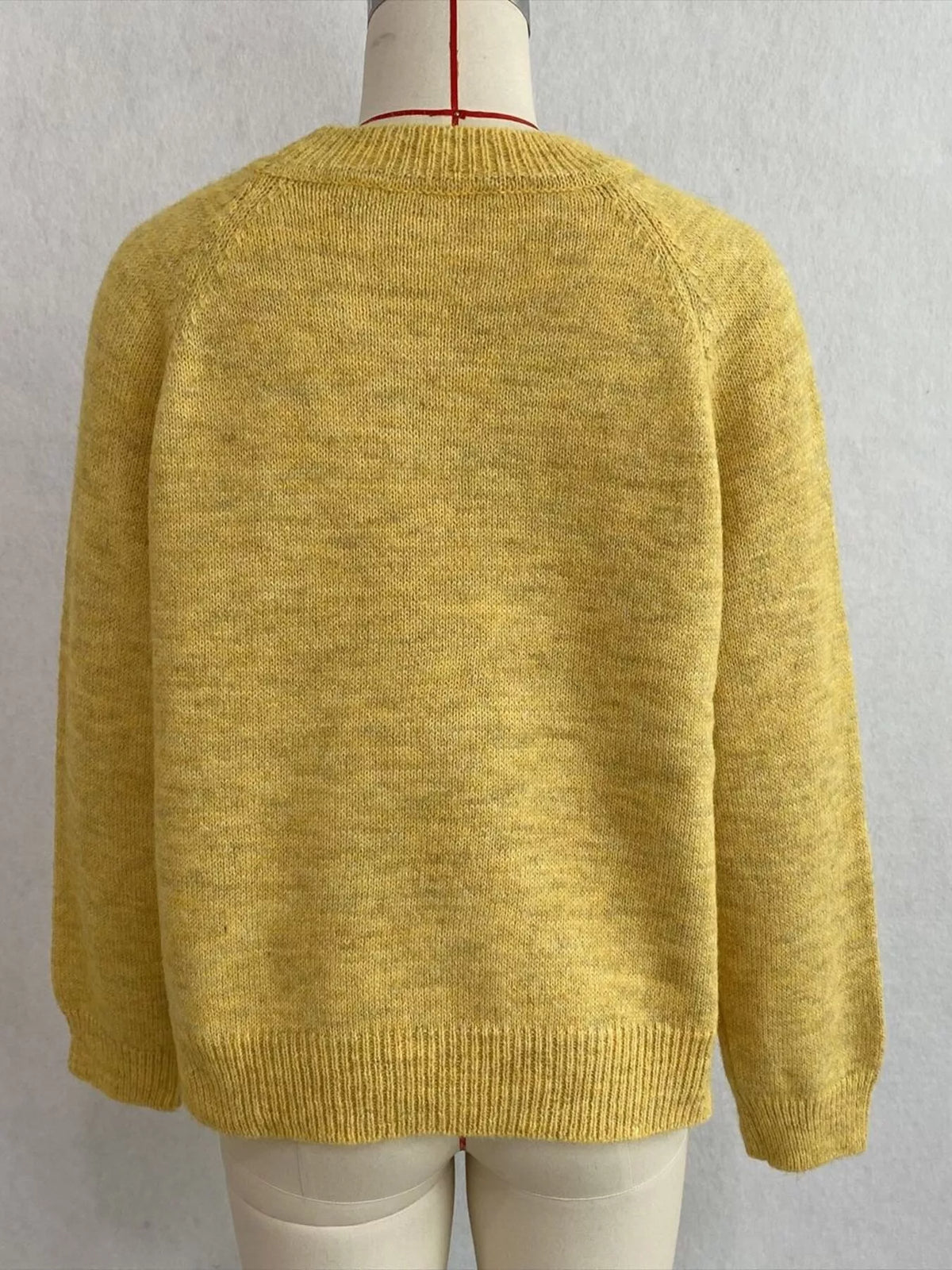 Floral embroidered round-neck sweater in yellow, back mannequin view