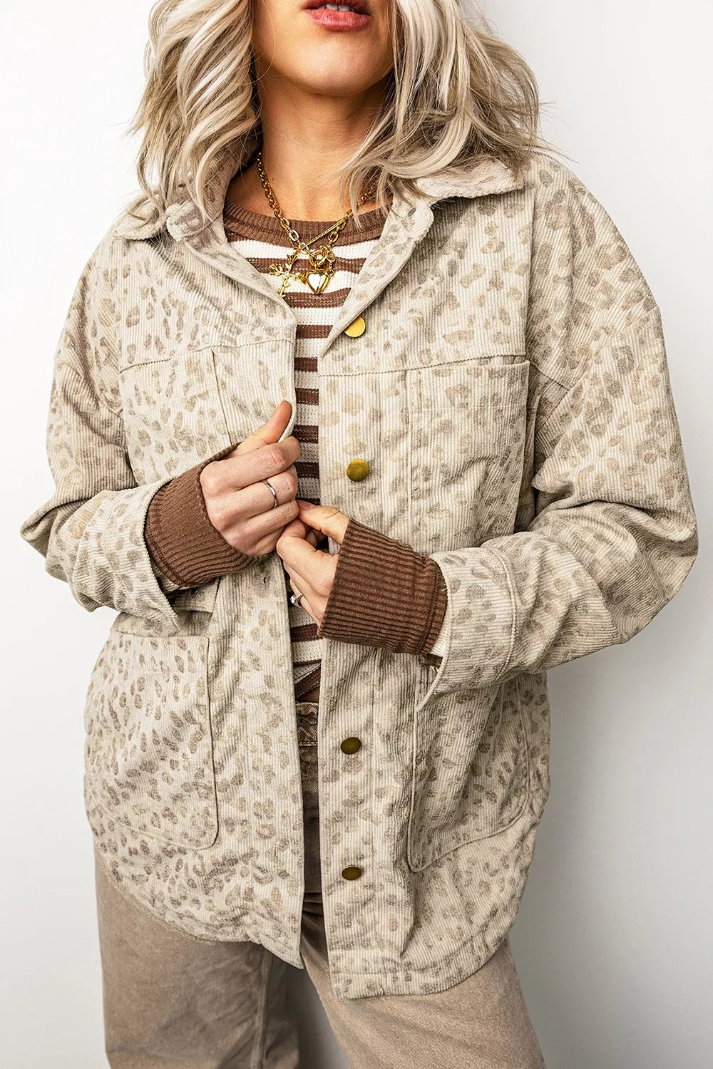 Beige leopard corduroy button-front jacket, front button placket detail.