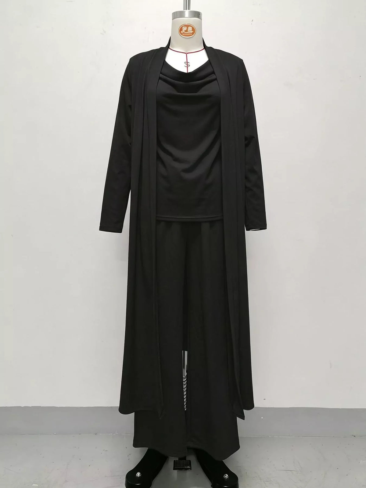 Black cowl neck top, cardigan and pants set, front view