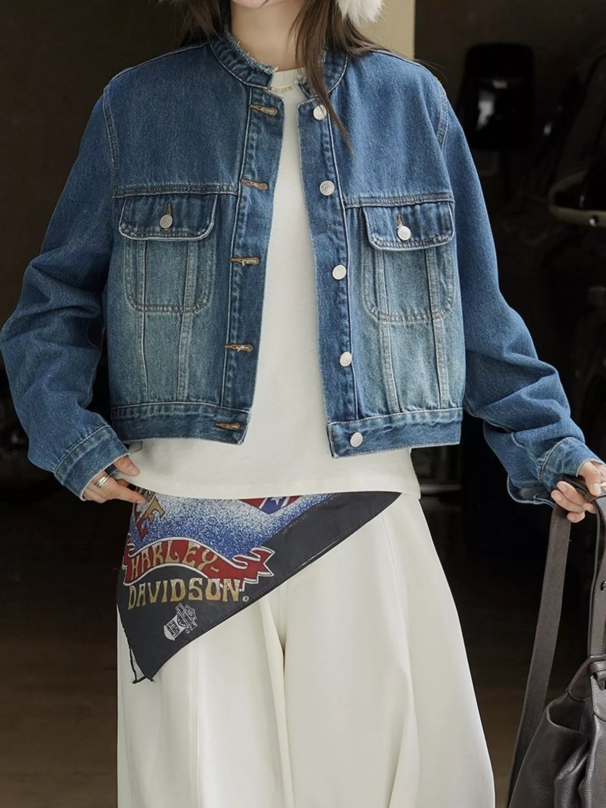 Blue button-up cropped denim jacket — front view