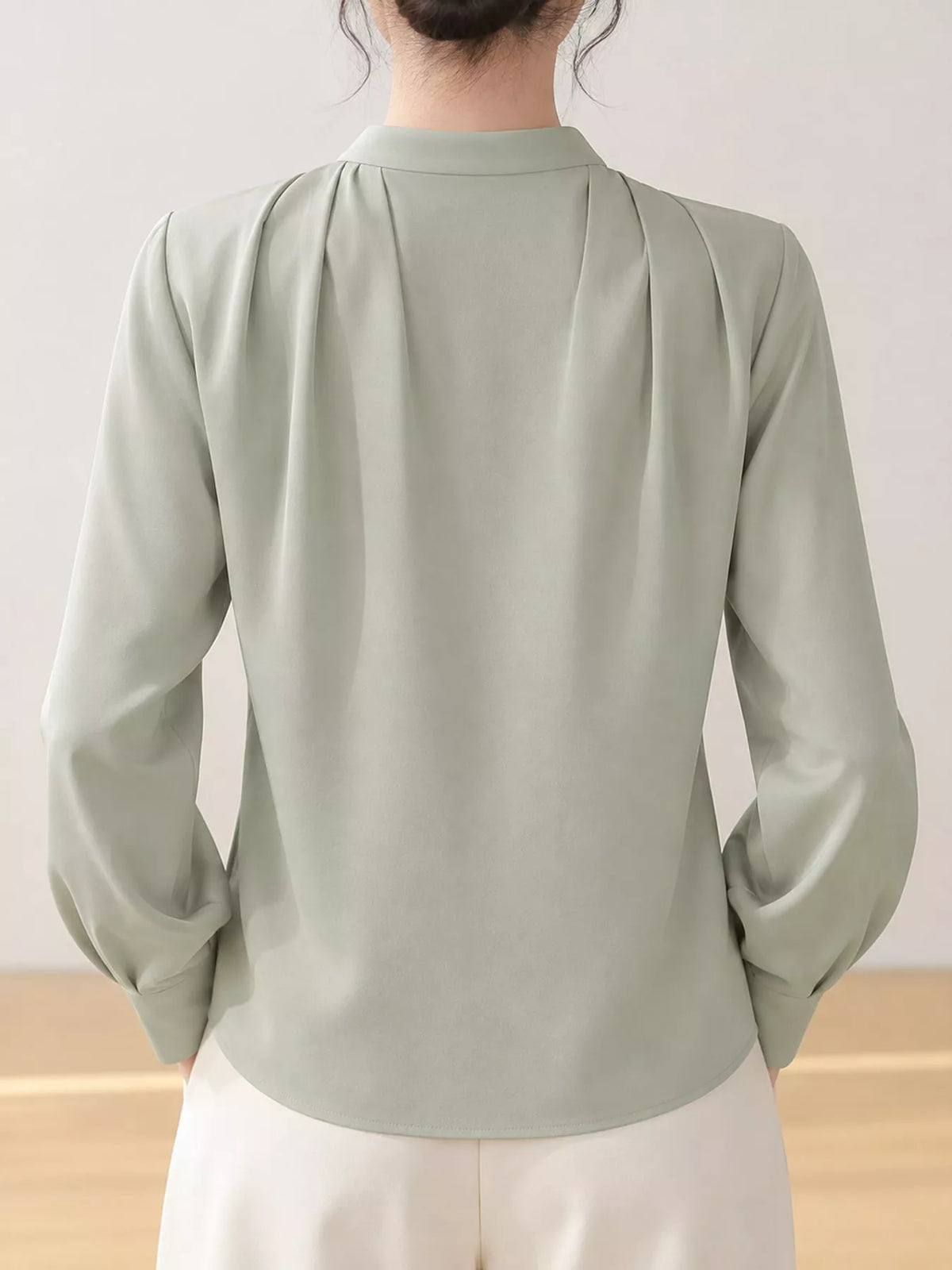 Women's V-Neck Pleated Shoulder Satin Blouse in sage — back view