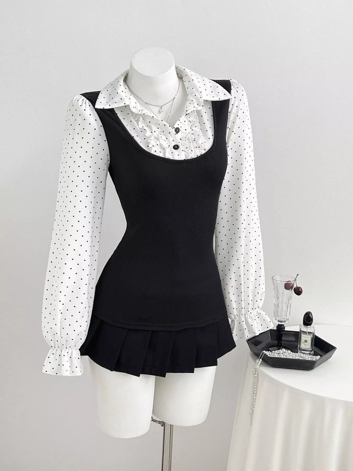Polka-dot blouse, black and white mannequin front