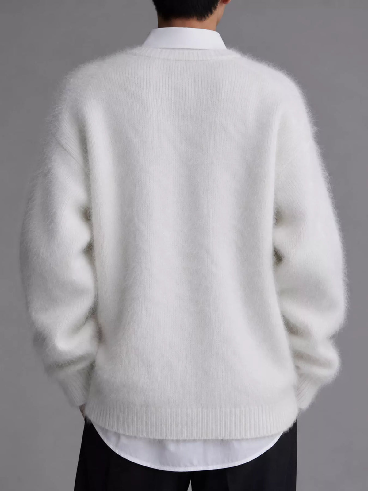 White fuzzy v-neck button-down cardigan, back view