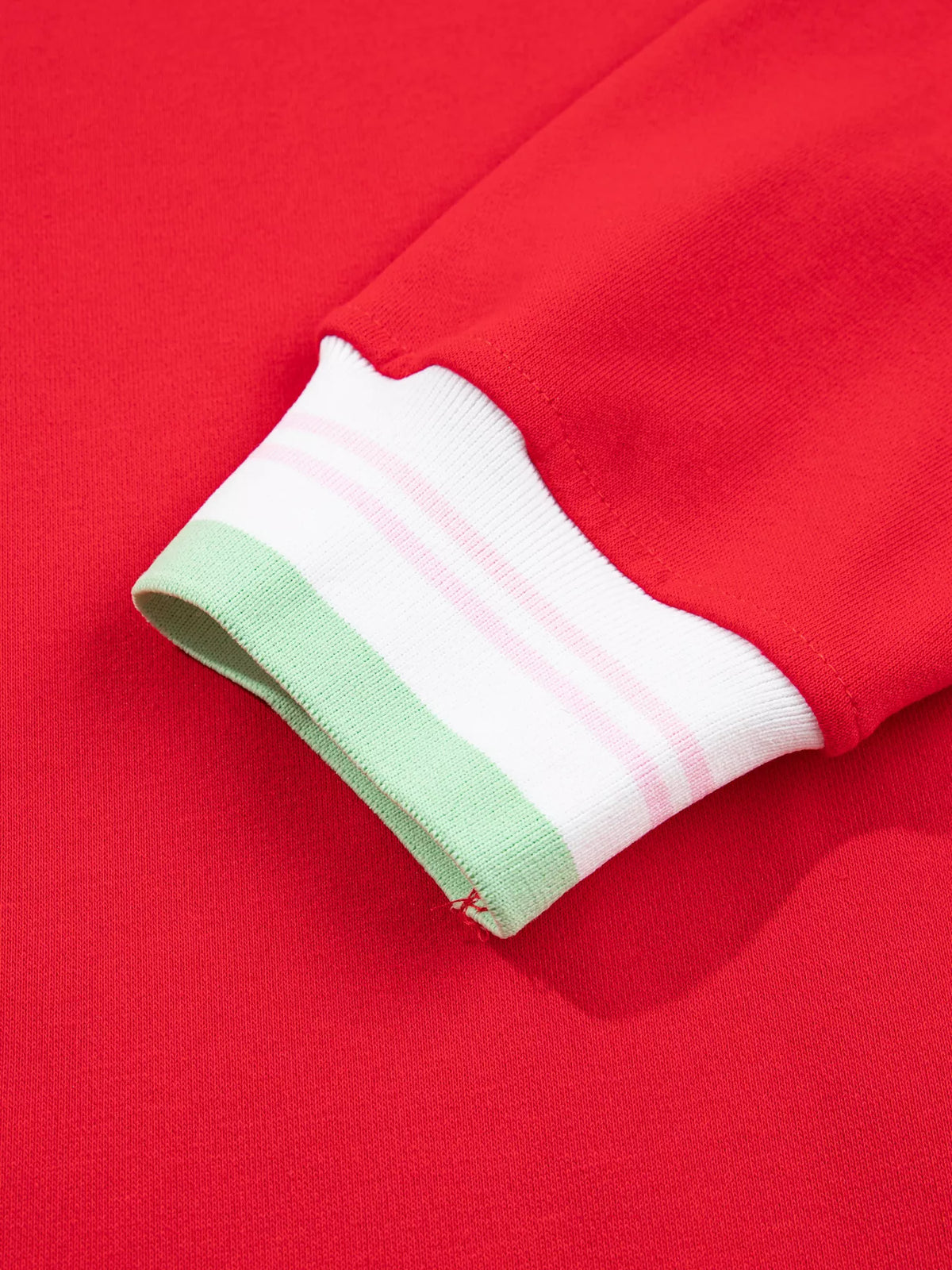 Red sweatshirt with contrast striped ribbed trim, cuff detail