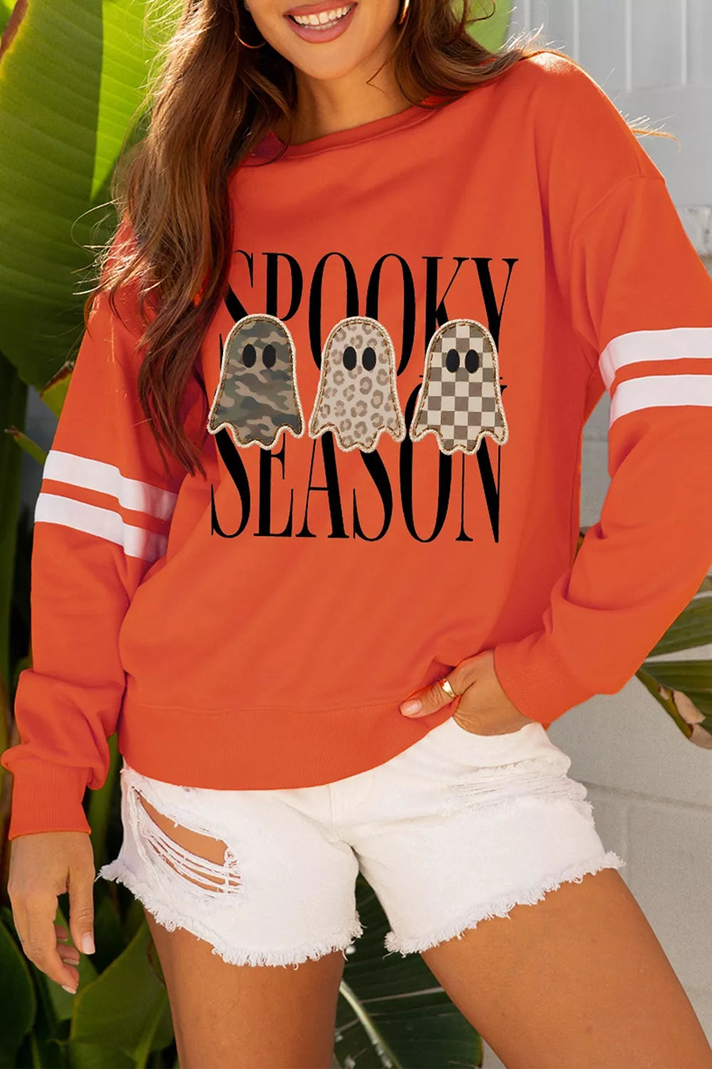 Spooky Season Ghost Striped Sleeve Sweatshirt in orange, front view