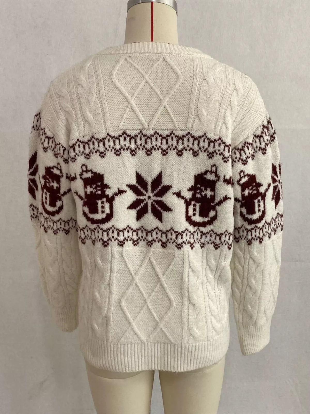 Ivory christmas snowman cable-knit sweater, back on dress form.