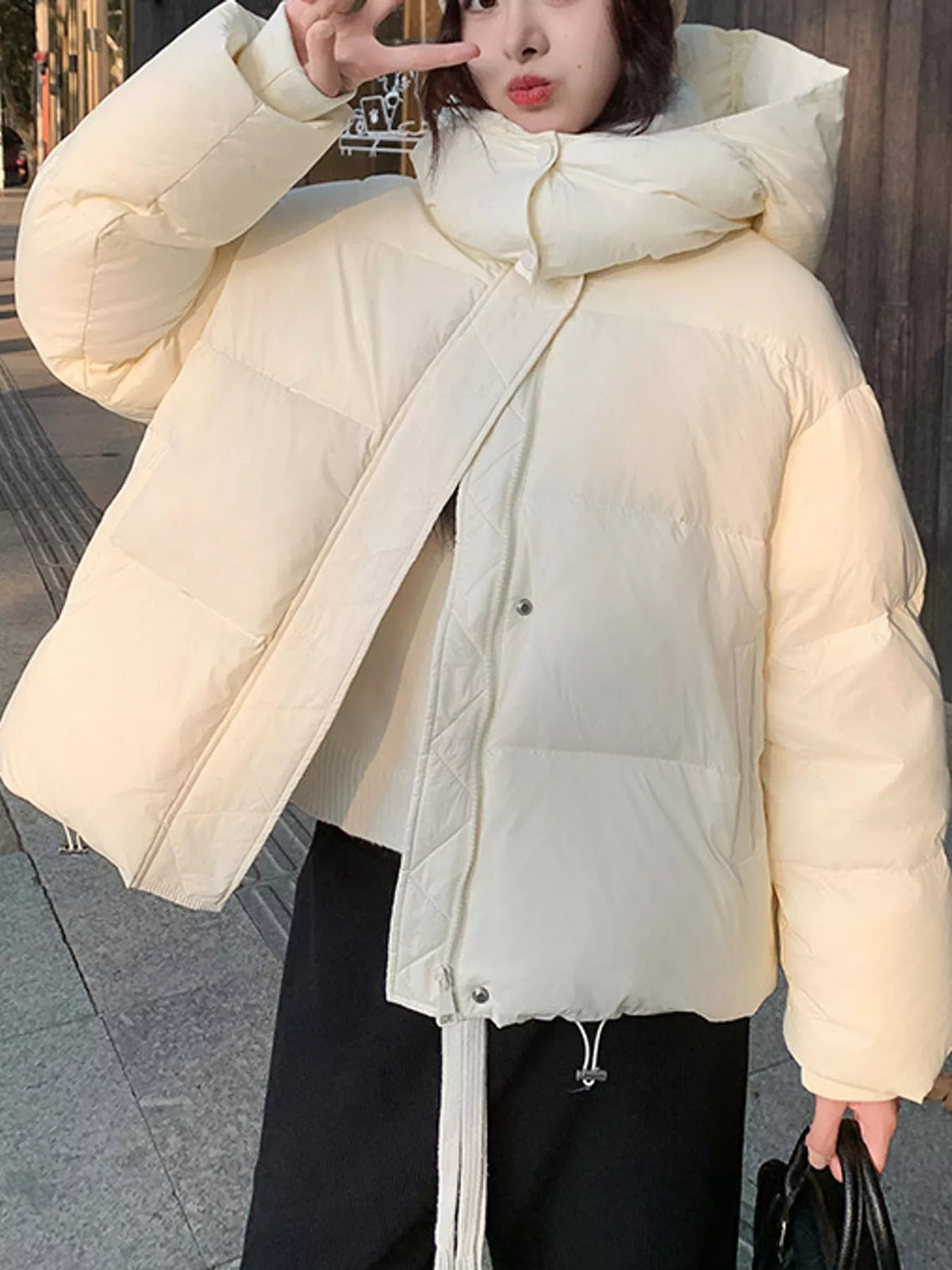 Cream quilted hooded puffer jacket, front view