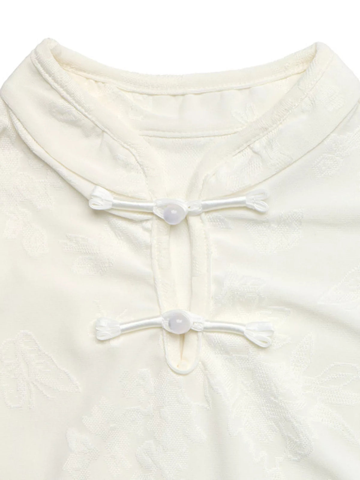 Ivory floral jacquard top with Mandarin collar and loop-button neckline, collar detail