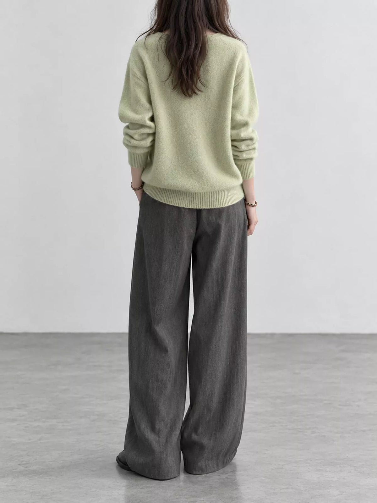 Light green v-neck sweater, back view