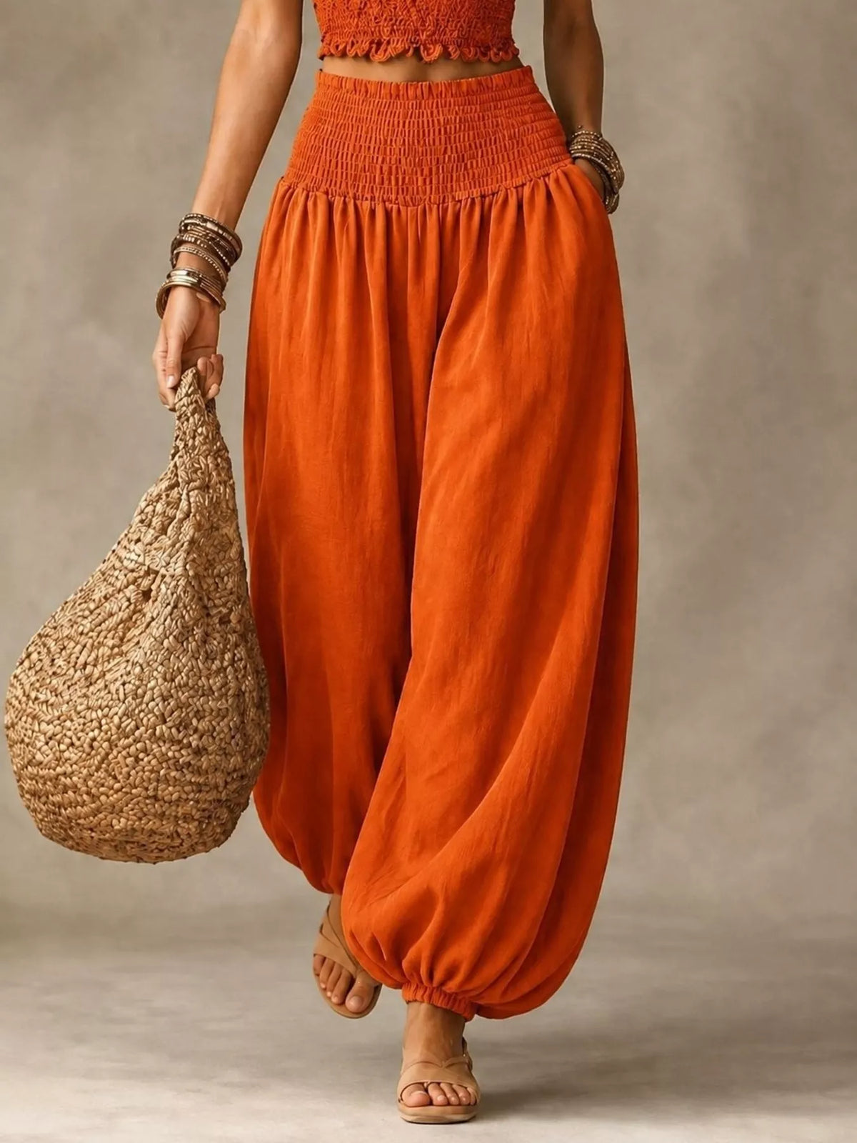 Women's Smocked Harem Pants in orange — front view