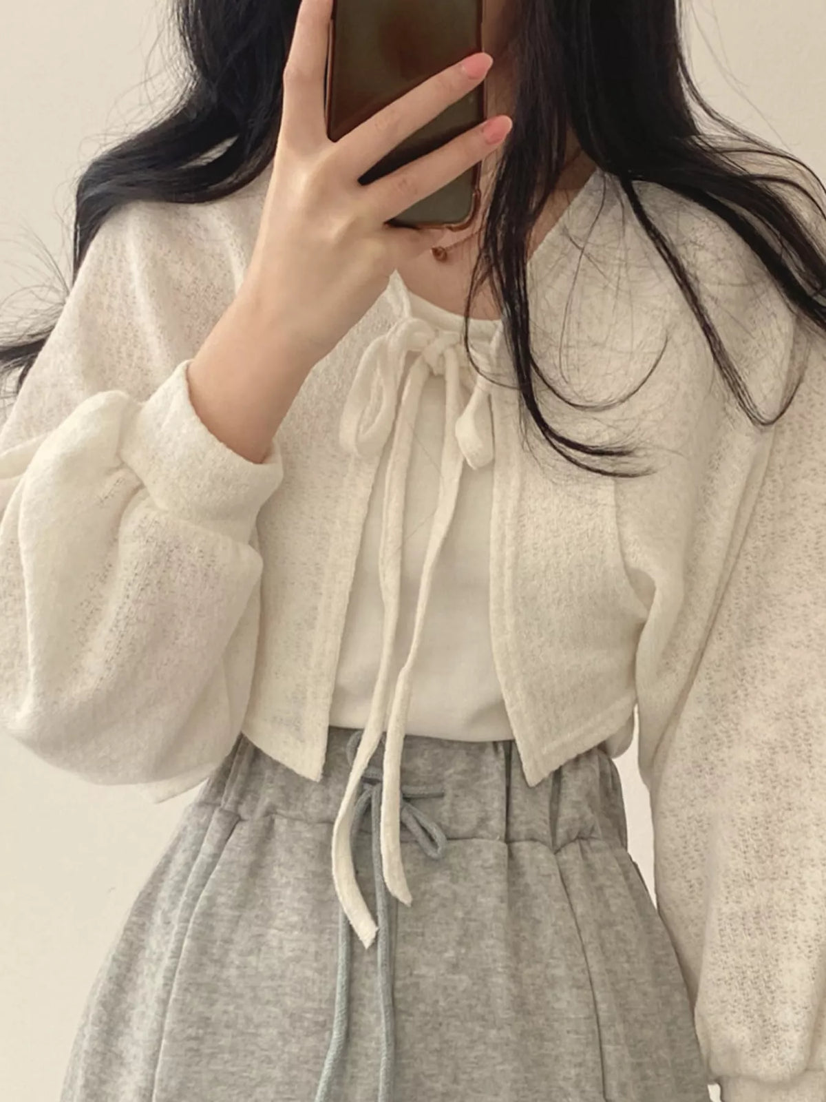 Round neck long sleeve cardigan, front view on model