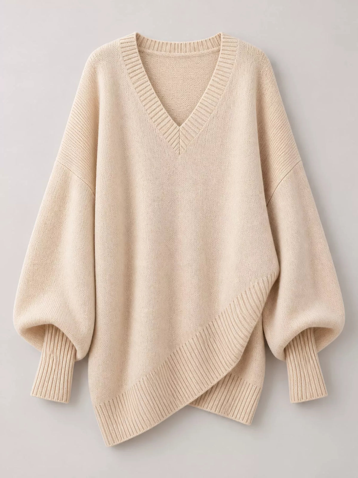 Batwing sweater, cream flat lay