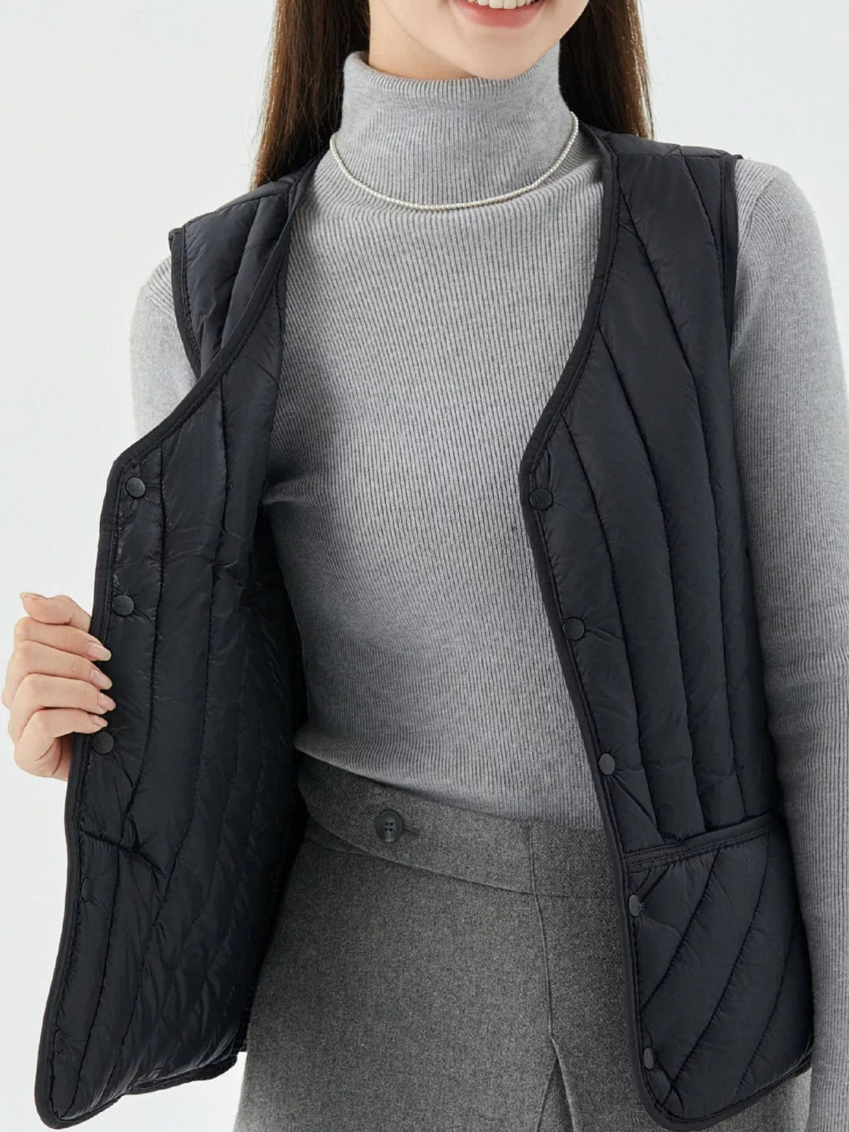 Quilted Button Up Vest in black, front view