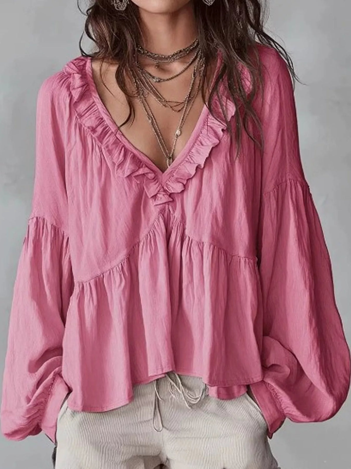 Pink ruffled v neck blouse, front view