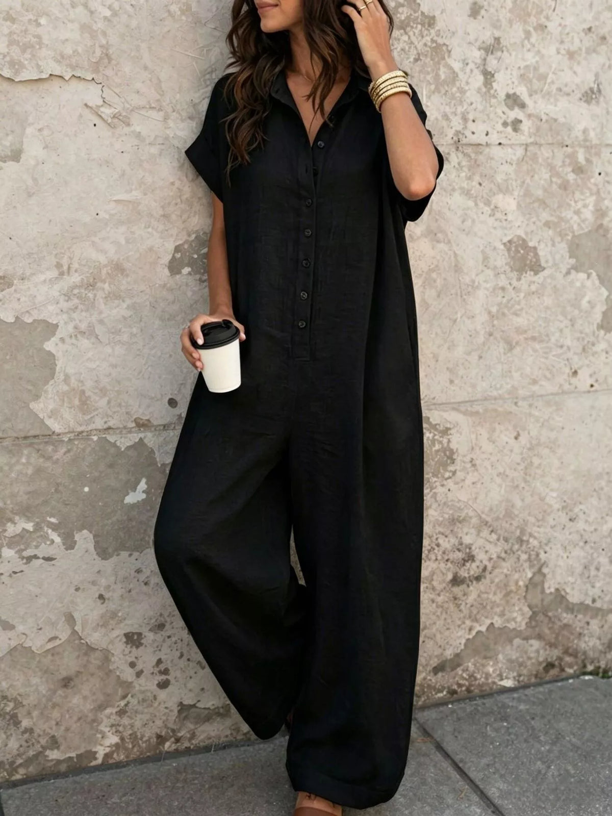 Black button-front jumpsuit, front view