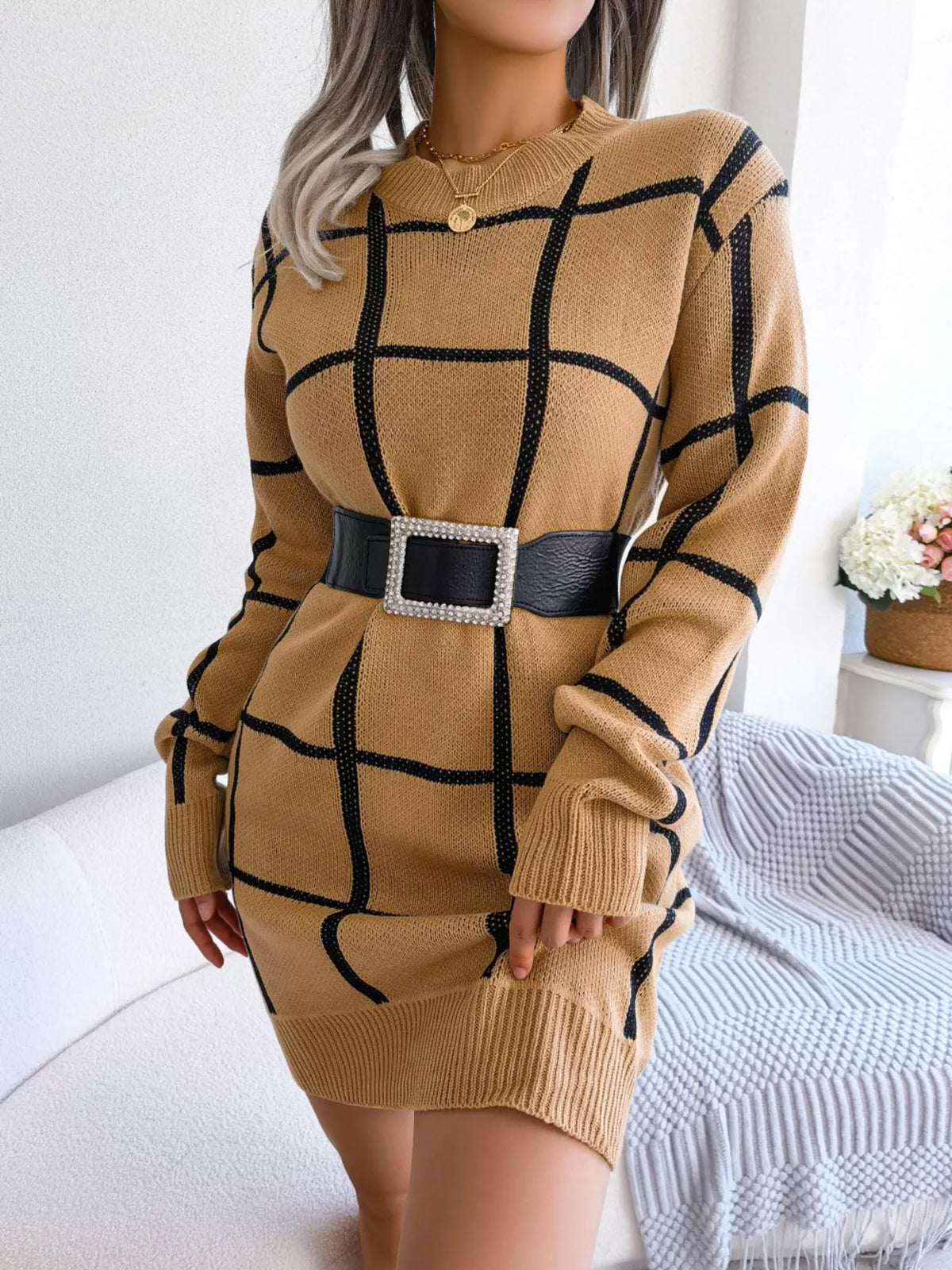 Camel windowpane long-sleeve sweater dress, belted front with handbag.